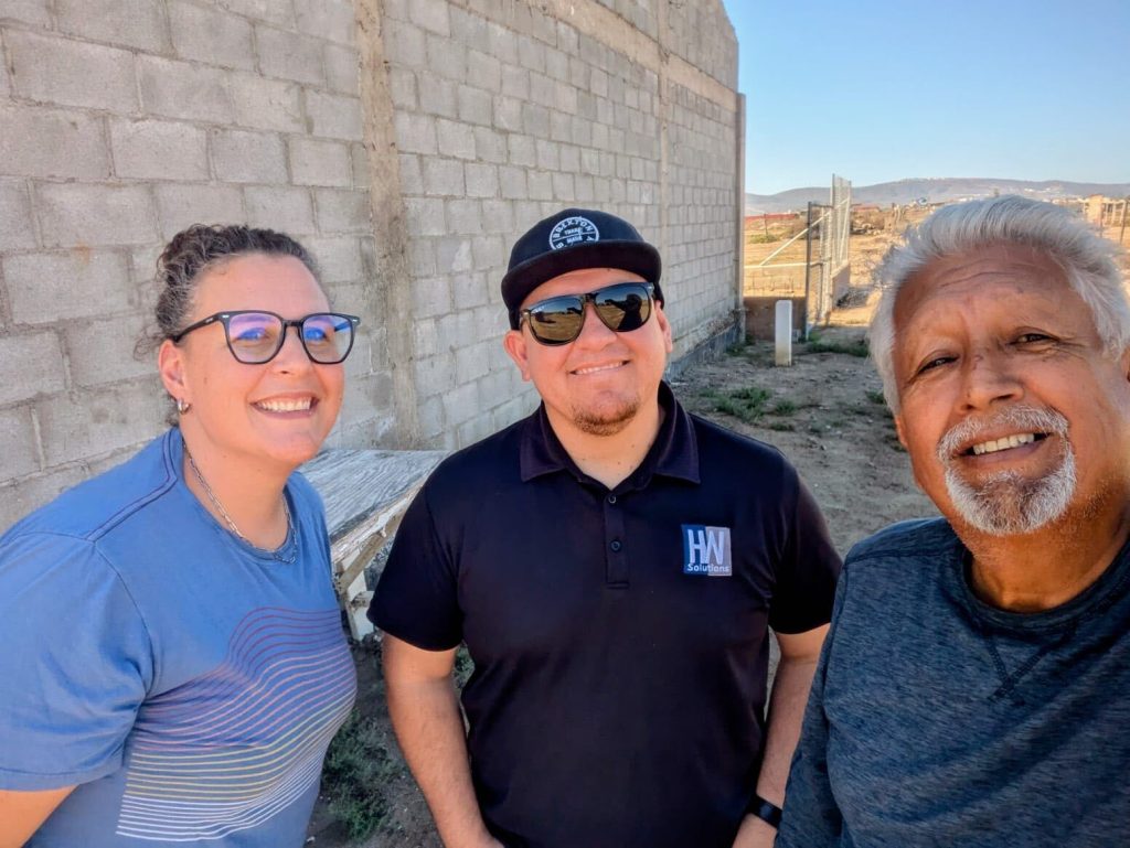 After the Storm in Maneadero Amy Carnall, local leaders Pastor Rodolfo, and our friend Luis from Encuentro Church.